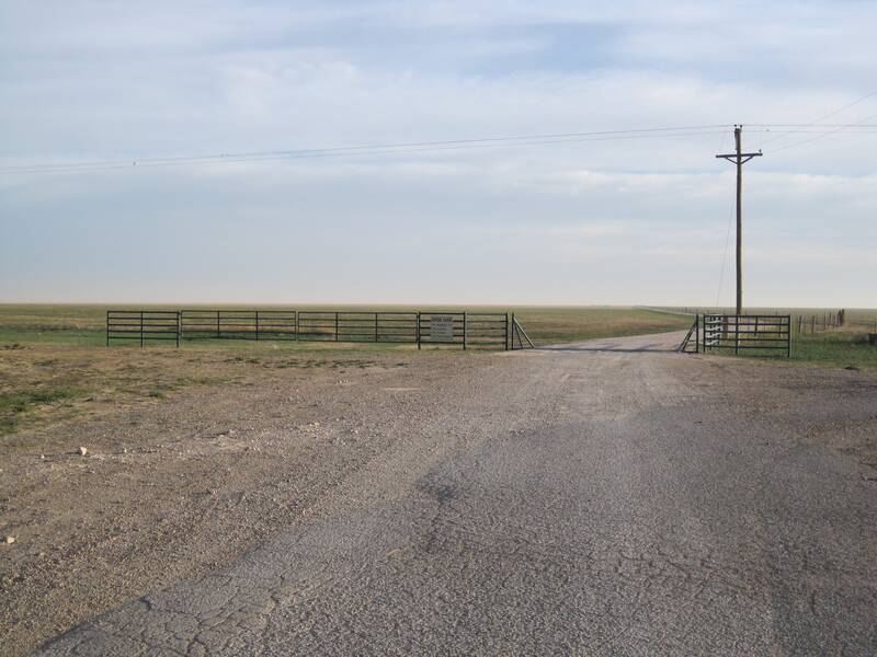 Pipe ranch gates along a fence line